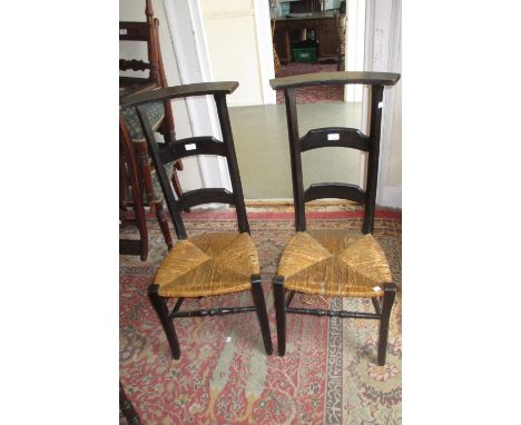 Pair of Edwardian marquetry inlaid side chairs, pair of Arts and Crafts ebonised ladder back side chairs with rush seats, pai