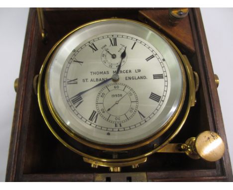 20th Century lacquered brass cased marine chronometer with 4in silvered dial having up, down and seconds dial, inscribed Thom