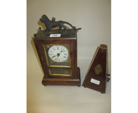 19th Century rosewood cased mantel clock with lion surmount together with a French walnut cased metronome