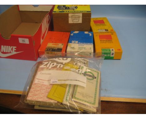 Quantity of vintage London Transport maps etc together with a quantity of bus related film negatives with viewer