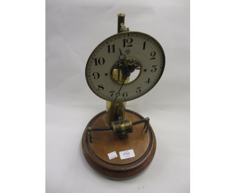 20th Century battery operated mantel clock, the white dial with Arabic numerals on a mahogany plinth (lacking dome)