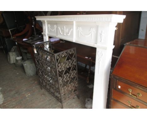 White painted Adam style fire surround decorated with urns and swags
