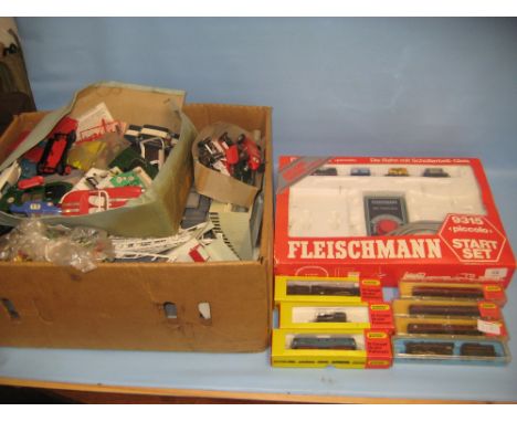 Three boxed Hornby Minitrix 'N' gauge engines, three boxed carriages, a Rivarossi 'N' gauge locomotive and tender, a Fleischm
