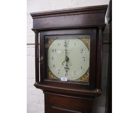 George III oak longcase clock, the square hood above a rectangular panelled door, the painted enamel dial with Roman numerals