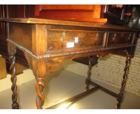 Early 20th Century oak two drawer side table on barley twist supports together with a similar stool