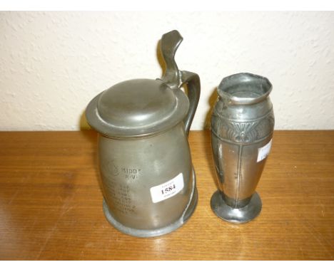 Tudric pewter lidded tankard, serial No. 066 with presentation engraving, together with a Tudric pewter vase of stylised Art 