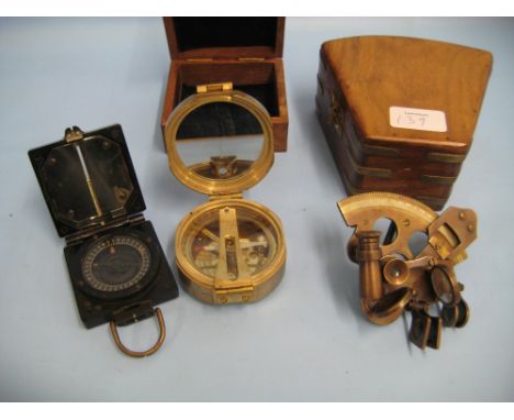 Black Bakelite cased mark I compass, by T.G. Co. Ltd, bearing M.O.D. arrow mark (a/f), modern wooden cased sextant and a simi