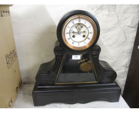 Large 19th Century black slate mantel clock having circular enamel dial with Roman numerals and visible escapement, the two t