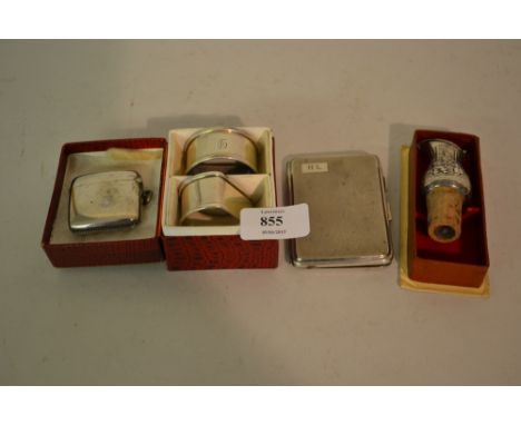 Silver cigarette case, silver vesta case, pair of silver napkin rings and a Continental white metal bottle pourer in box