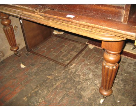 Mid Victorian rectangular mahogany extending dining table, the moulded top raised on turned tapering fluted supports with bra