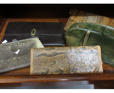 Ladies green lizard skin vintage handbag, two snakeskin clutch bags, an alligator skin bag and another leather bag