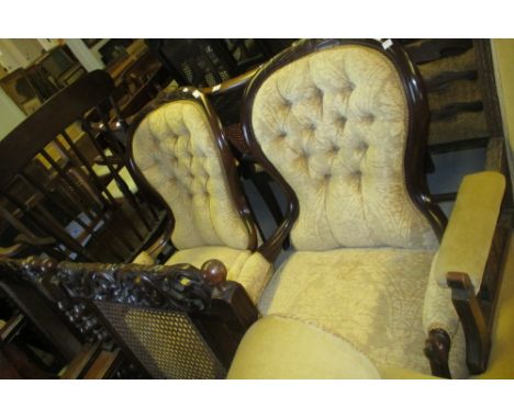 Pair of reproduction mahogany and button upholstered spoon back elbow chairs in Victorian style