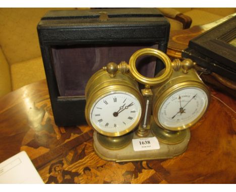 20th Century gilt brass cased carriage clock with thermometer and barometer on marble plinth with leather travelling case, th