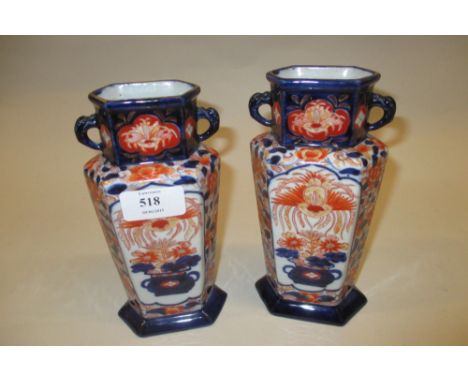 Pair of small 19th Century Ironstone vases of irregular hexagonal form decorated in Imari colours