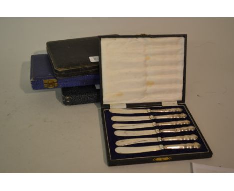 Two cased sets of silver handled tea knives together with two other cased sets of plated flatware