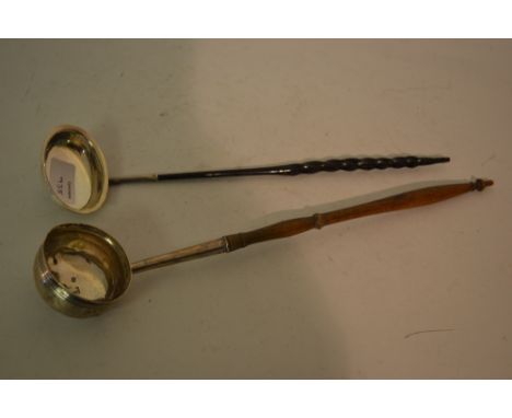 George III silver toddy ladle with a turned wooden handle, together with another toddy ladle with a twisted and pierced whale