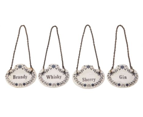 A SET OF FOUR CERAMIC DECANTER LABELS
20th Century
Comprising: Gin; Brandy; Sherry and Whisky, with foliate border
6cm wide
C