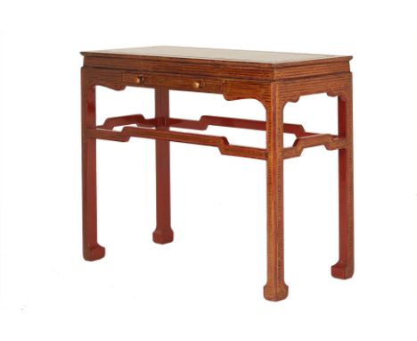 A GOLD &amp; RED LACQUER CONSOLE TABLE
A gold and red lacquer console table with a single fitted frieze drawer, the supports 