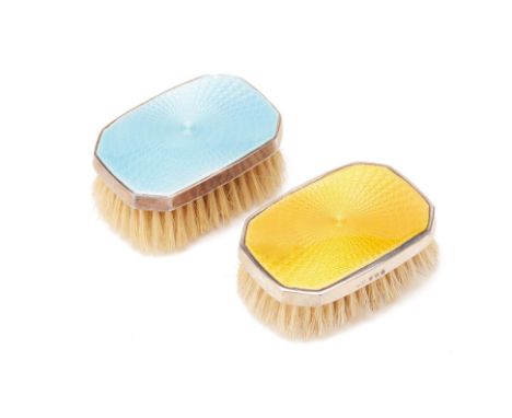 A PAIR OF ANTIQUE SILVER MOUNTED GUILLOCHE ENAMEL BRUSHES
One yellow-gold and one light blue with marks for Birmingham, 1927

