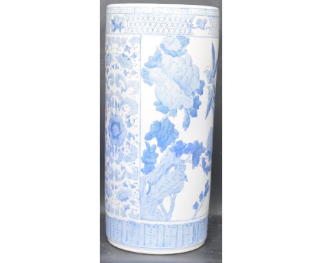 A vintage 20th century Chinese Oriental blue and white ceramic stick stand of cylindrical form having floral and foliate deco