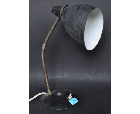 A retro vintage industrial mid 20th century goose neck lamp having a pierced conical shade adjustable support raised on a cir