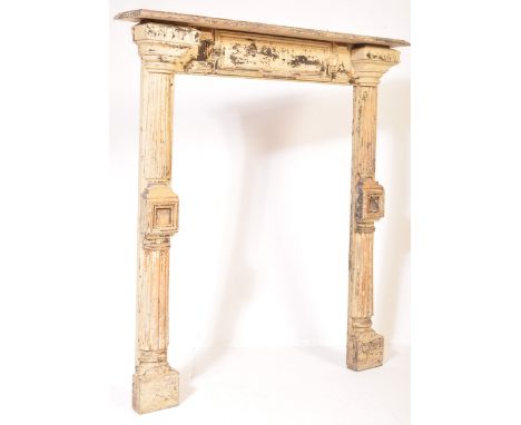 An 18th Century French painted fireplace surround. The surround having a white/yellow colourway, pillars/columns support the 