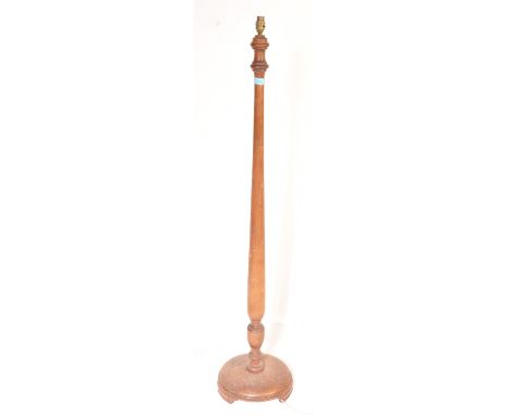 A mid 20th century mahogany standard lamp having a turned column support raised on a circular base.&nbsp;Measures approx: 148