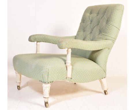 A 19th century Victorian library armchair having having chesterfield style back, cushioned elbow rests raised on turned feet 
