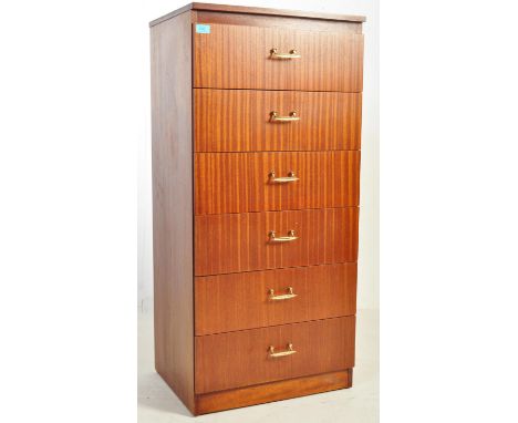 A retro vintage mid 20th century circa 1960's teak pedestal chest of drawers having brass shaped handles raised on an upright