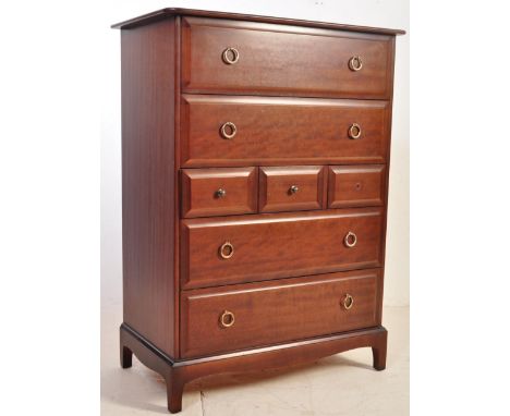 A vintage 20th Century Stag Minstrel mahogany tallboy chest of drawers having a flared top with four full drawers and three s