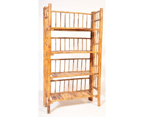 A retro vintage 20th century bamboo whatnot / display shelving unit having a series of shelves with upright supports. Measure
