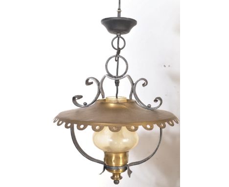 A late 20th century brass and spelter pendant ceiling light shade having a scalloped brass disc shade with moulded spelter fi