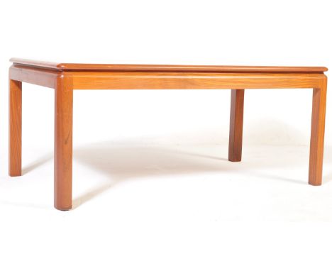 A retro vintage mid 20th century G Plan coffee table having a chamfered edge raised on upright supports. Measures 46cm x 106c