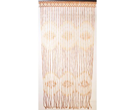 A retro vintage circa. 1970's wooden bead door curtain having hanging turned beads in a variety of shapes.&nbsp;Measures appr