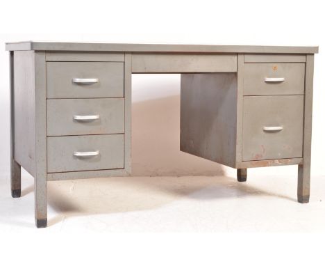 A retro vintage mid 20th century twin pedestal metal desk having a painted desk top over two banks of three drawers, each wit