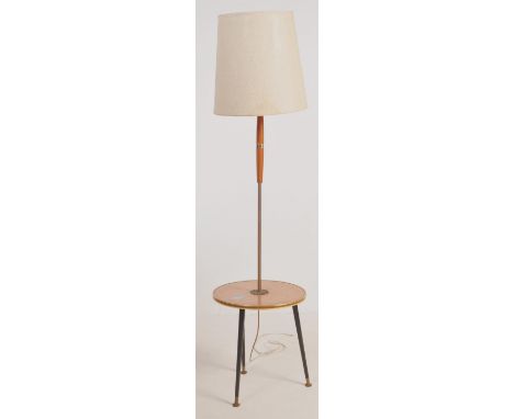 A retro mid 20th century circa. 1960's standard floor standing lamp having a cream chenille shade with fluted teak wood and c