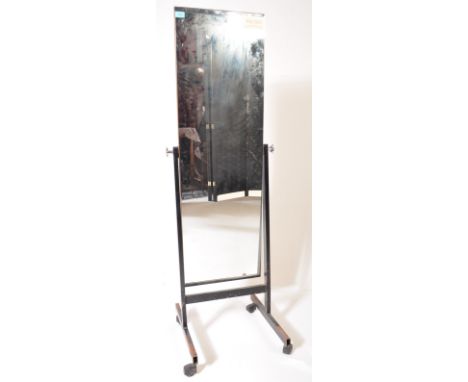 A retro vintage 20th century full length space age industrial shop haberdashery cheval mirror of rectangular form raised on b