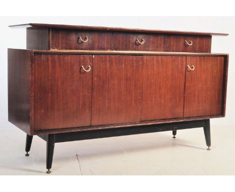 A retro vintage circa 1960s E Gomme / G Plan Librenza Tola wood sideboard having a floating shelf over a run of three drawers