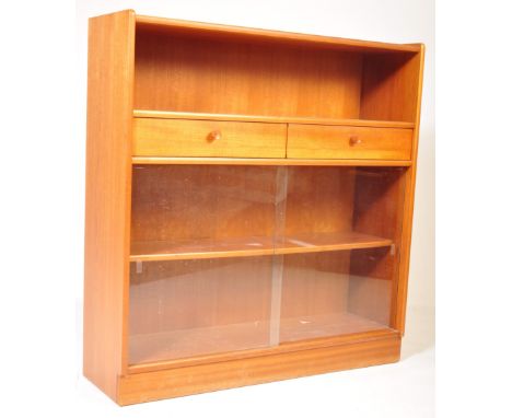 Nathan - A retro mid 20th century circa. 1970's Nathan teak bookcase cabinet having a shelf over two rectangular drawers over