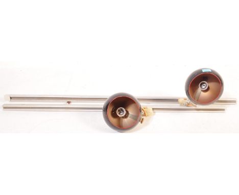 A pair of retro vintage 20th century industrial factory lighting having a strip line support with two globular light shades.&