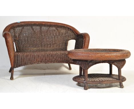 A vintage retro 20th century wicker conservatory garden sofa and coffee table. The sofa having a tubular woven frame to each.