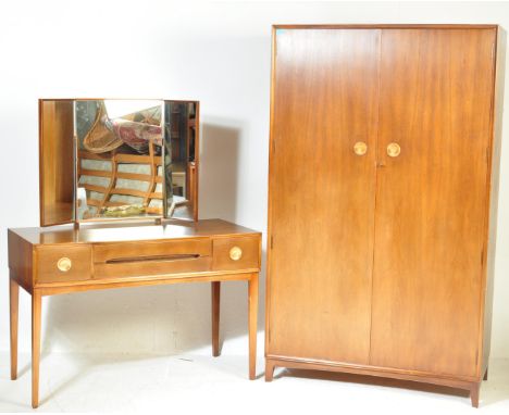 A retro vintage mid 20th century teak bedroom suite by Vespa. The suite comprising of a double door wardrobe with wooden hand