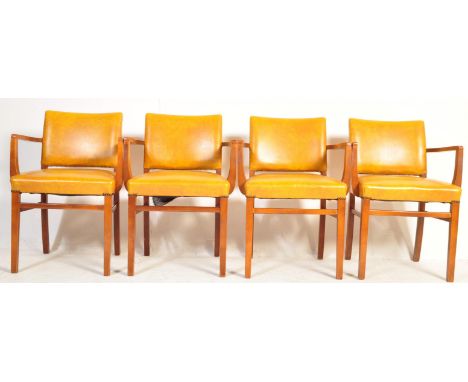 A set of four retro vintage mid 20th century beech and leather upholstered carver chairs in the manner of ben chairs. The cha
