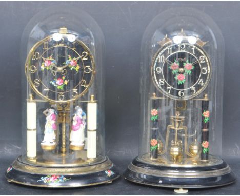 A pair of 20th century German skeleton anniversary 400-day clocks to include a Kien clock having hand painted face and base w