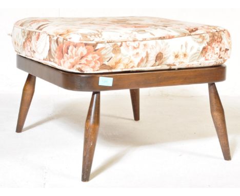Ercol - Lucien Ercolani - A retro vintage mid 20th century Ercol dark wood foot stool raised on tapering supports with shaped