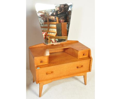 E. Gomme- G Plan - Brandon Range - A retro vintage 20th Century light oak dressing table chest having a central mirror panel 