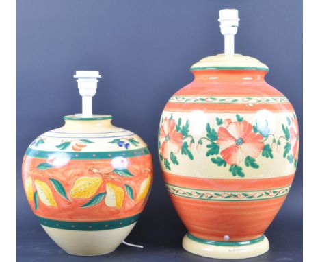 Two vintage mid 20th century hand painted crackle glaze ceramic lamp stands of bulbous colourful ovoid form having floral det
