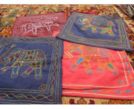 A box of mainly modern Indian cushion covers in many different designs 