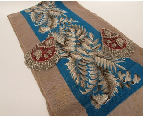 An example of Victorian beadwork, turquoise ground with buff, white and bronze fern leaf design, 123cm x 23cm together with a