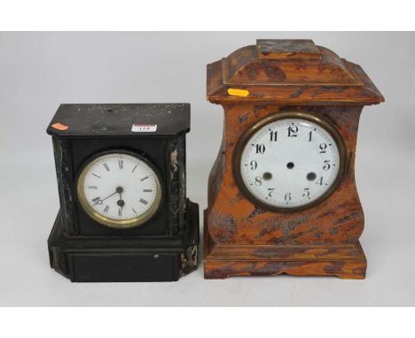 A late Victorian black slate and marble cased mantel clock having an enamel dial with Roman numerals and 30 hour movement, wi